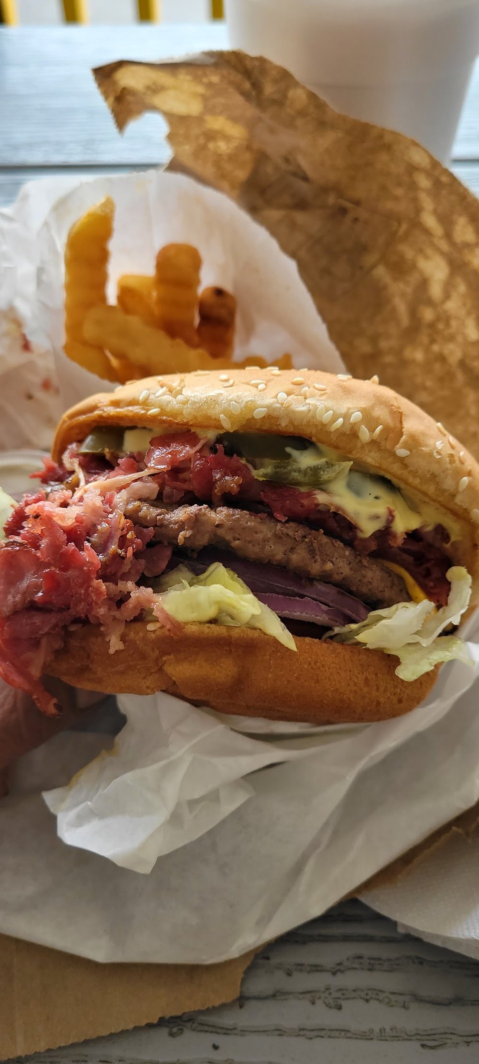 Drive-in menu featuring burgers and fries.