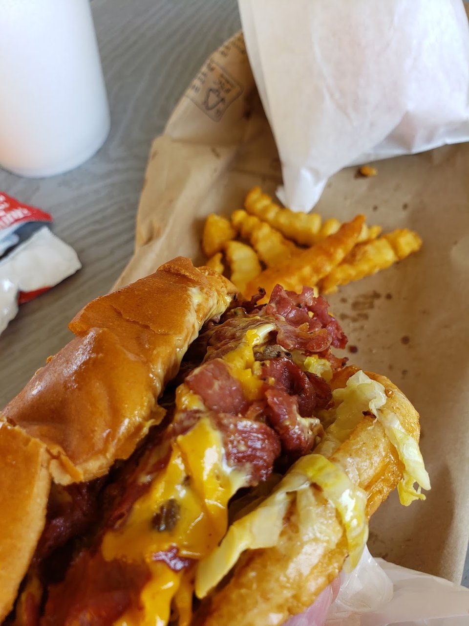 Menu board showing burgers and combo meals.